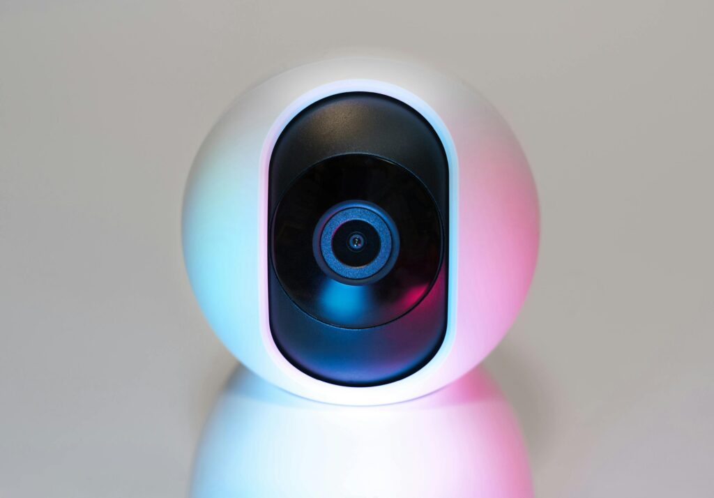 Futuristic IP security camera in soft lighting, perfect for modern smart home setups.